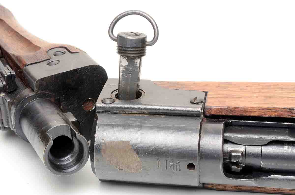 The Japanese developed takedown versions of their Arisaka Type 99 7.7mm. It used a rectangular pin to attach the barrel to the action.